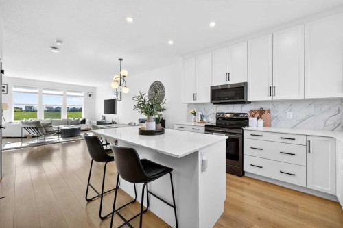 87 Heirloom Boulevard Se, Calgary, AB - Indoor Photo Showing Kitchen With Upgraded Kitchen