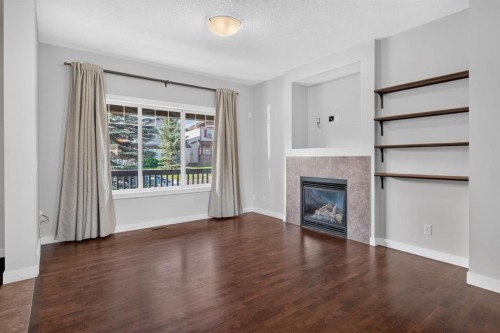 22 Panora Road Nw, Calgary, AB - Indoor Photo Showing Living Room With Fireplace