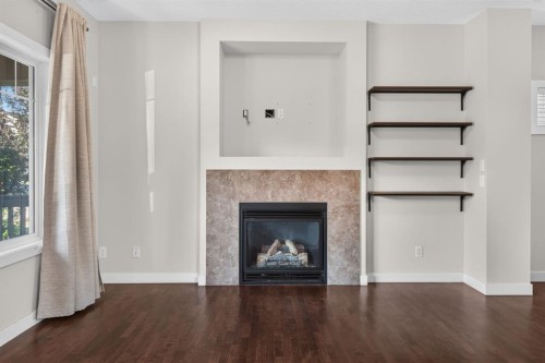 22 Panora Road Nw, Calgary, AB - Indoor Photo Showing Living Room With Fireplace
