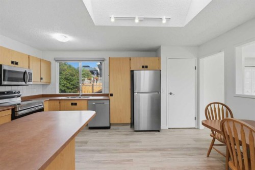 731 Queensland Drive Se, Calgary, AB - Indoor Photo Showing Kitchen With Stainless Steel Kitchen With Double Sink
