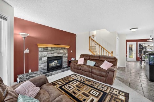 155 Tarington Green Ne, Calgary, AB - Indoor Photo Showing Living Room With Fireplace