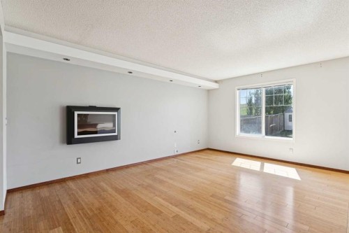 172 Kincora Drive Nw, Calgary, AB - Indoor Photo Showing Living Room With Fireplace