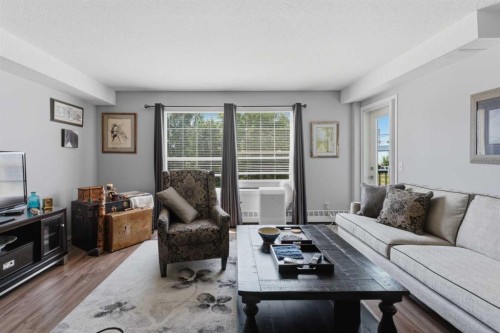 208-105 7 Avenue Se, High River, AB - Indoor Photo Showing Living Room
