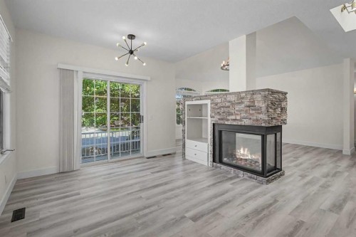 47 Christie Park Terrace Sw, Calgary, AB - Indoor Photo Showing Living Room With Fireplace