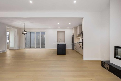 15 Alpine Green Sw, Calgary, AB - Indoor With Fireplace