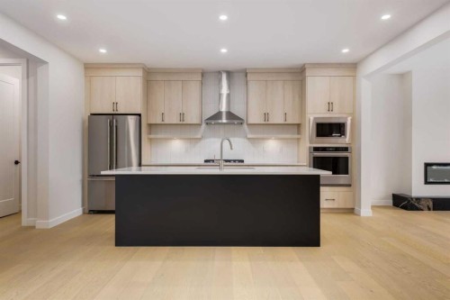 15 Alpine Green Sw, Calgary, AB - Indoor Photo Showing Kitchen With Upgraded Kitchen