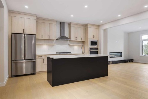 15 Alpine Green Sw, Calgary, AB - Indoor Photo Showing Kitchen With Stainless Steel Kitchen With Upgraded Kitchen