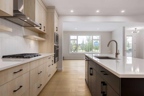 15 Alpine Green Sw, Calgary, AB - Indoor Photo Showing Kitchen With Upgraded Kitchen