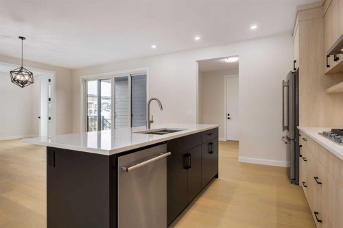 15 Alpine Green Sw, Calgary, AB - Indoor Photo Showing Kitchen With Double Sink With Upgraded Kitchen