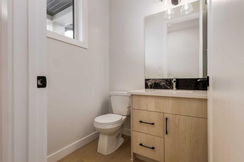 15 Alpine Green Sw, Calgary, AB - Indoor Photo Showing Bathroom