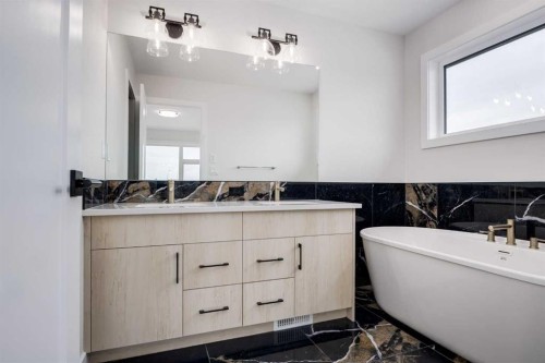15 Alpine Green Sw, Calgary, AB - Indoor Photo Showing Bathroom
