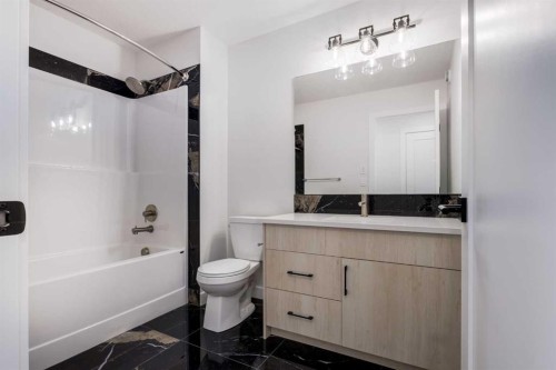 15 Alpine Green Sw, Calgary, AB - Indoor Photo Showing Bathroom