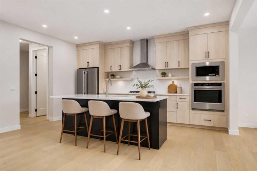 15 Alpine Green Sw, Calgary, AB - Indoor Photo Showing Kitchen With Stainless Steel Kitchen With Upgraded Kitchen