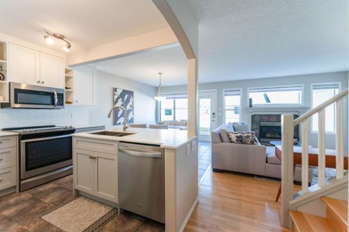 82 West Springs Way Sw, Calgary, AB - Indoor Photo Showing Kitchen With Stainless Steel Kitchen With Double Sink