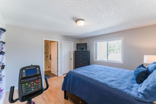 82 West Springs Way Sw, Calgary, AB - Indoor Photo Showing Bedroom