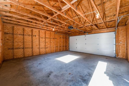 82 West Springs Way Sw, Calgary, AB - Indoor Photo Showing Garage