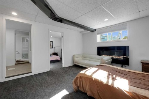 6507 Rundlehorn Drive Ne, Calgary, AB - Indoor Photo Showing Bedroom With Fireplace