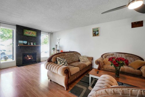 6507 Rundlehorn Drive Ne, Calgary, AB - Indoor Photo Showing Living Room With Fireplace
