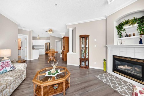 210-78 Prestwick Gardens Se, Calgary, AB - Indoor Photo Showing Living Room With Fireplace