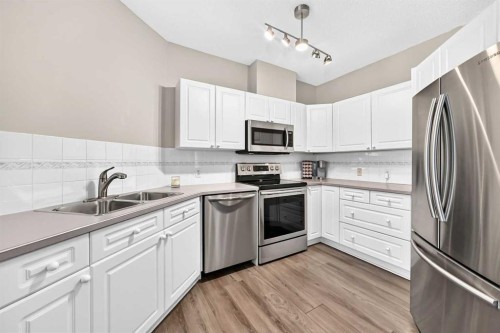 210-78 Prestwick Gardens Se, Calgary, AB - Indoor Photo Showing Kitchen With Stainless Steel Kitchen With Double Sink