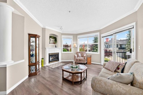 210-78 Prestwick Gardens Se, Calgary, AB - Indoor Photo Showing Living Room With Fireplace