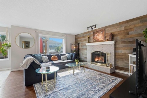 161 Douglasbank Way Se, Calgary, AB - Indoor Photo Showing Living Room With Fireplace