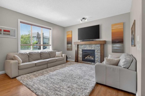 159 Sherwood Crescent Nw, Calgary, AB - Indoor Photo Showing Living Room With Fireplace