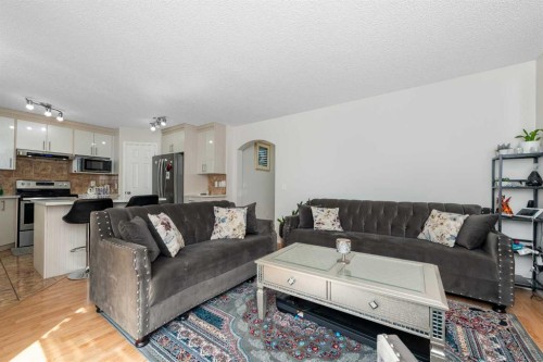 210 Taracove Landing Ne, Calgary, AB - Indoor Photo Showing Living Room