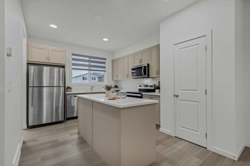 172 Belmont Way Sw, Calgary, AB - Indoor Photo Showing Kitchen With Stainless Steel Kitchen