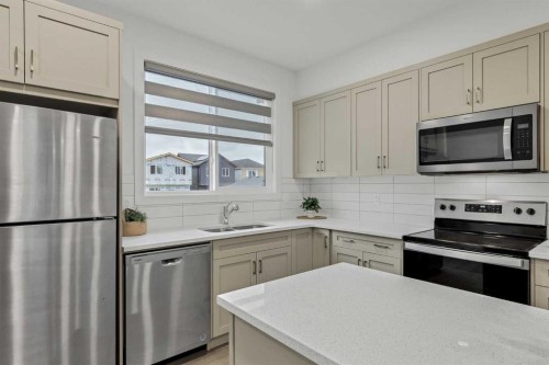 172 Belmont Way Sw, Calgary, AB - Indoor Photo Showing Kitchen With Stainless Steel Kitchen With Double Sink With Upgraded Kitchen