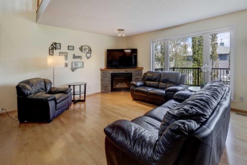 189 Citadel Crest Park Nw, Calgary, AB - Indoor Photo Showing Living Room With Fireplace