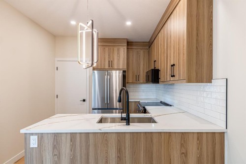 1997 Mccaskill Drive, Crossfield, AB - Indoor Photo Showing Kitchen With Upgraded Kitchen