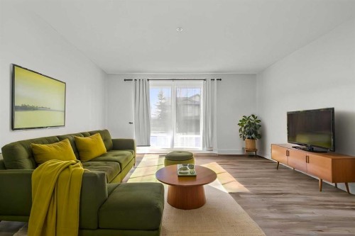 2105-2371 Eversyde Avenue Sw, Calgary, AB - Indoor Photo Showing Living Room