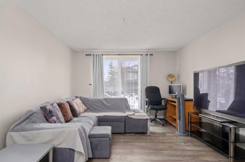 2105-2371 Eversyde Avenue Sw, Calgary, AB - Indoor Photo Showing Living Room