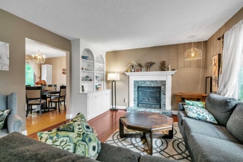 5820 Dalmead Crescent Nw, Calgary, AB - Indoor Photo Showing Living Room With Fireplace
