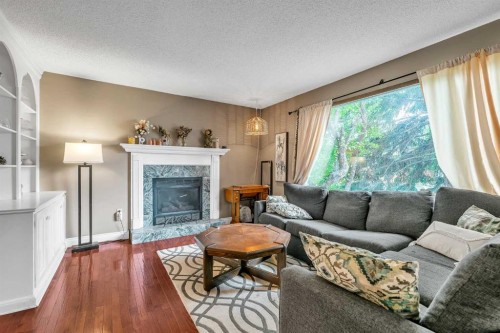 5820 Dalmead Crescent Nw, Calgary, AB - Indoor Photo Showing Living Room With Fireplace