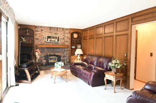 168 Templewood Drive Ne, Calgary, AB - Indoor Photo Showing Living Room With Fireplace