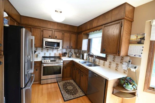 168 Templewood Drive Ne, Calgary, AB - Indoor Photo Showing Kitchen With Double Sink