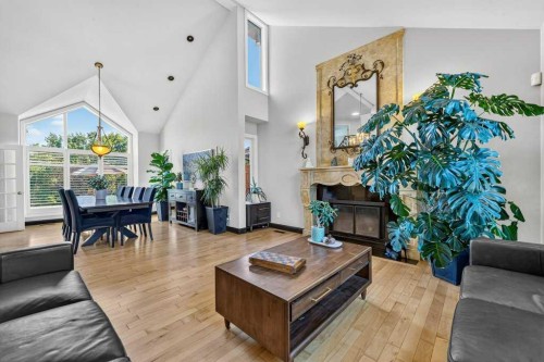 95 Woodridge Close Sw, Calgary, AB - Indoor Photo Showing Living Room With Fireplace