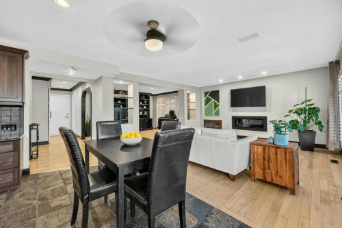 95 Woodridge Close Sw, Calgary, AB - Indoor Photo Showing Dining Room With Fireplace