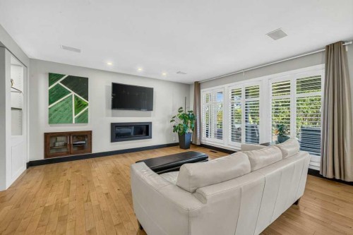 95 Woodridge Close Sw, Calgary, AB - Indoor Photo Showing Living Room With Fireplace