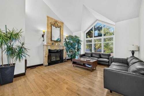 95 Woodridge Close Sw, Calgary, AB - Indoor Photo Showing Living Room With Fireplace