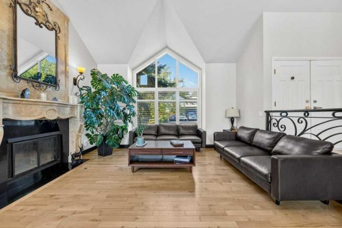95 Woodridge Close Sw, Calgary, AB - Indoor Photo Showing Living Room With Fireplace