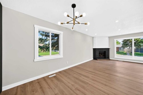 704 Malvern Drive Ne, Calgary, AB - Indoor With Fireplace