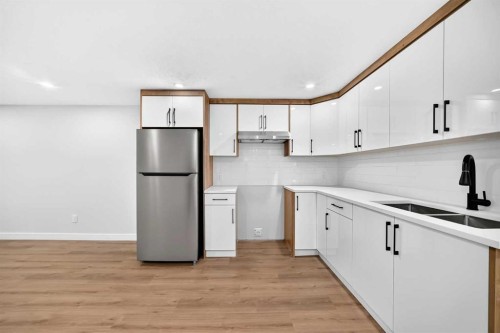 704 Malvern Drive Ne, Calgary, AB - Indoor Photo Showing Kitchen With Double Sink