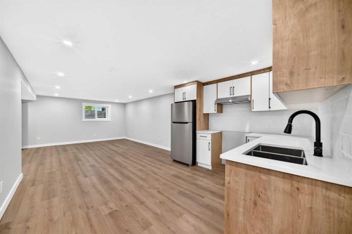 704 Malvern Drive Ne, Calgary, AB - Indoor Photo Showing Kitchen With Double Sink
