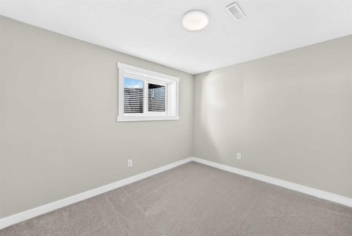 704 Malvern Drive Ne, Calgary, AB - Indoor Photo Showing Other Room