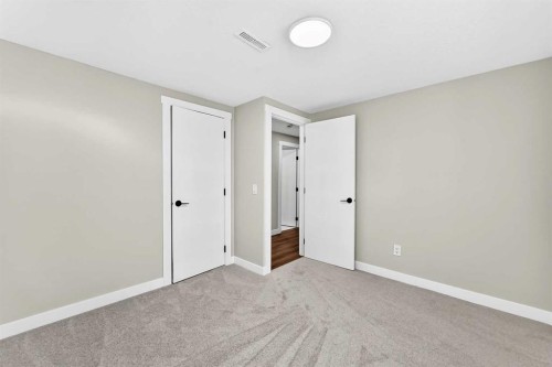 704 Malvern Drive Ne, Calgary, AB - Indoor Photo Showing Other Room