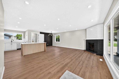 704 Malvern Drive Ne, Calgary, AB - Indoor With Fireplace