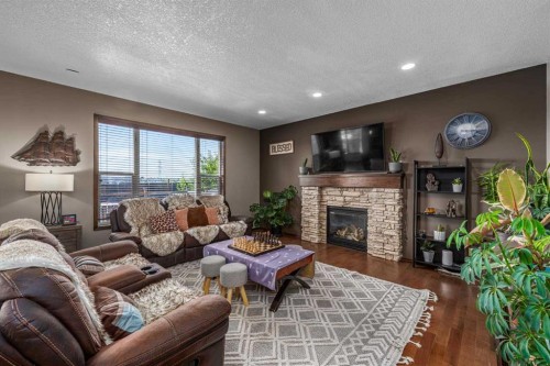 173 Pantego Road Nw, Calgary, AB - Indoor Photo Showing Living Room With Fireplace